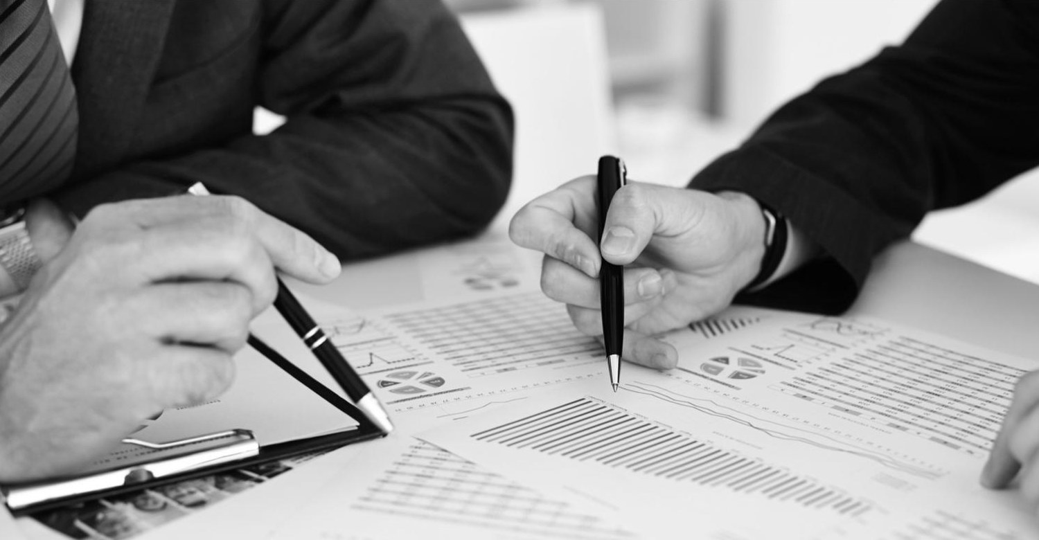 Reviewing financial reports in a meeting